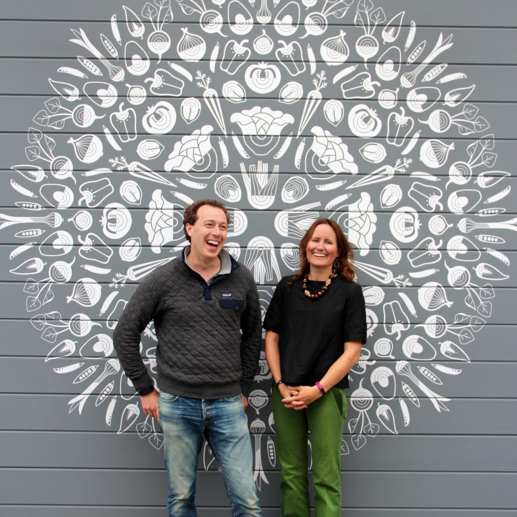 IMG_1927 - Salad Near Me | MIXT People in front of a wall