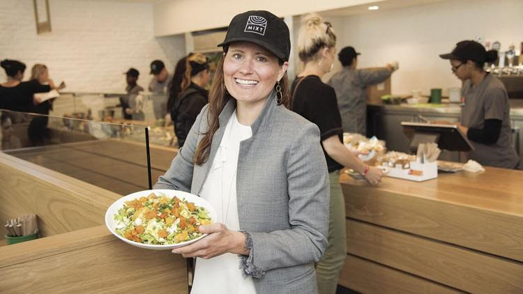 Leslie Silverglide Co-Founder and CEO of MIXT, holding a Mandarin salad